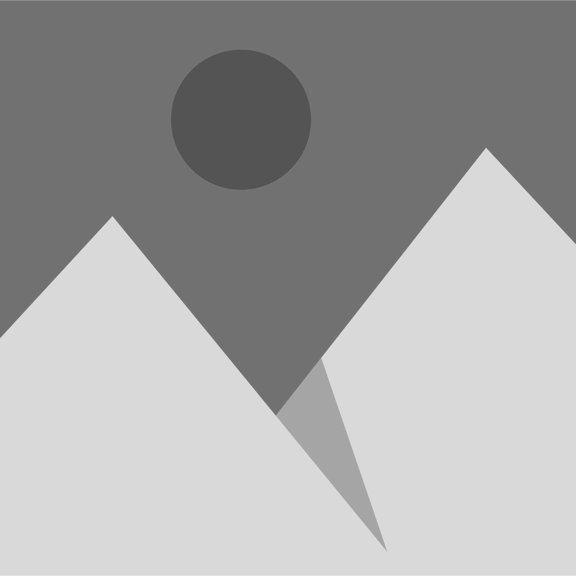 A gray and black mountain with a sun in the sky.