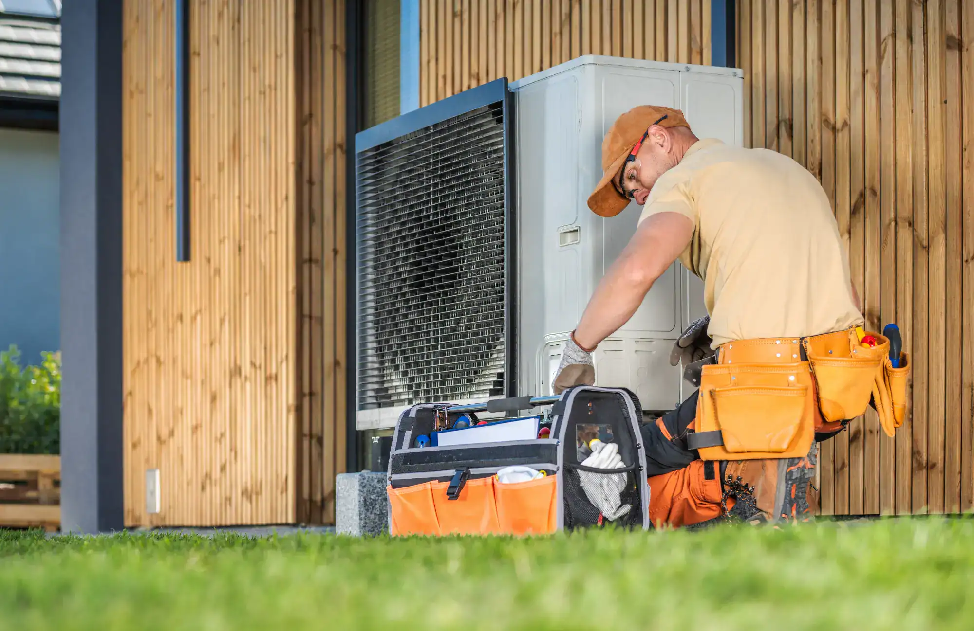 A man working on an air conditioner.